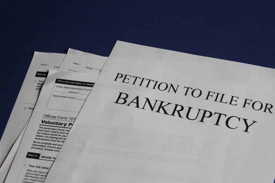 Cover illustration for Personal bankruptcy options, showing a calculator, debt folders, and two branching paths